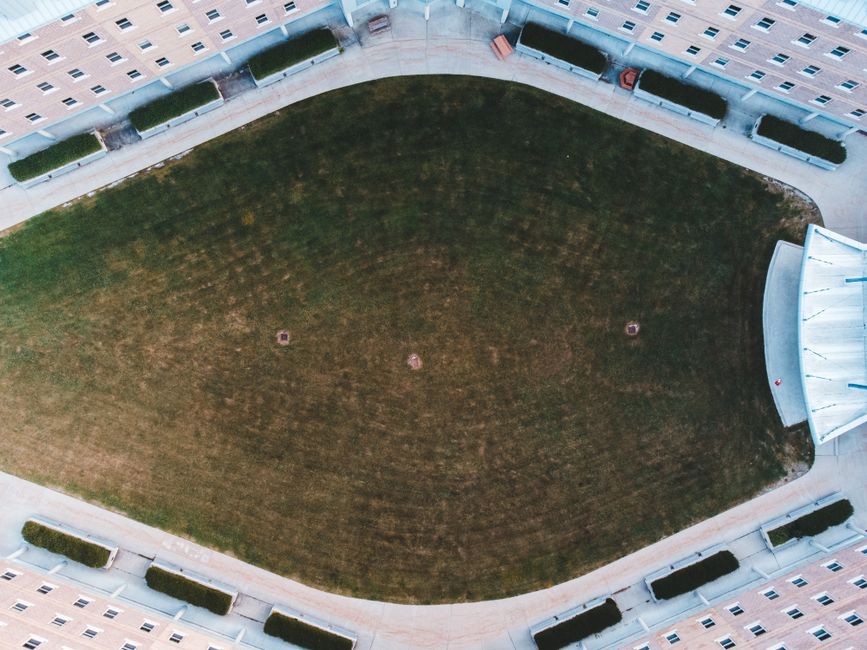 top-down view of a robot vacuum with mop attachment, showing water reservoir and microfiber pad