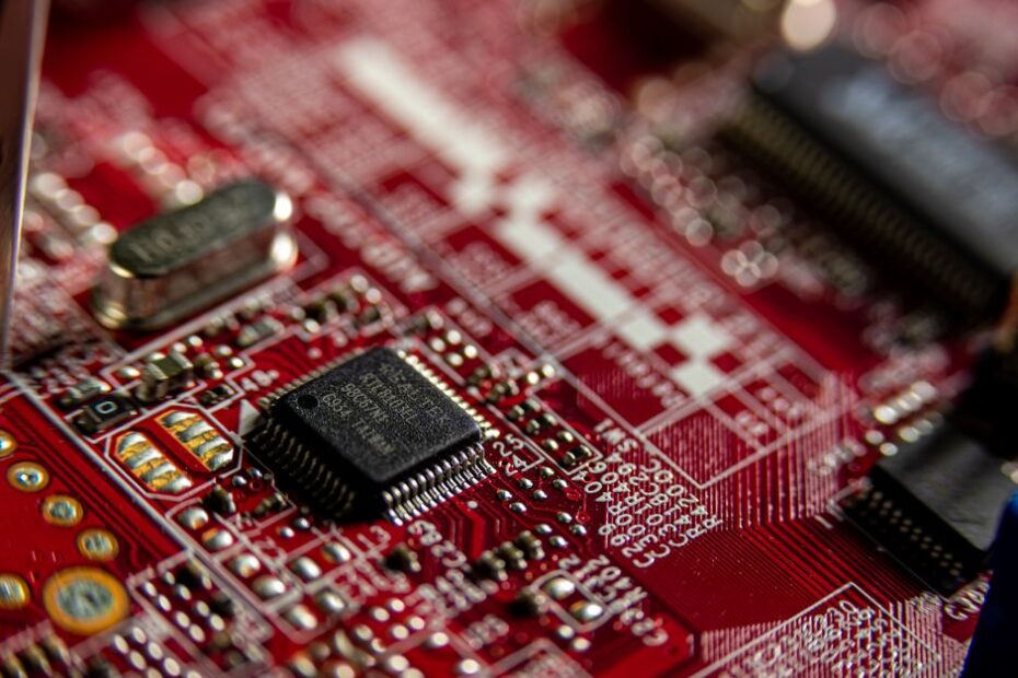 macro shot of a microchip circuit board with glowing lines, editorial tech style